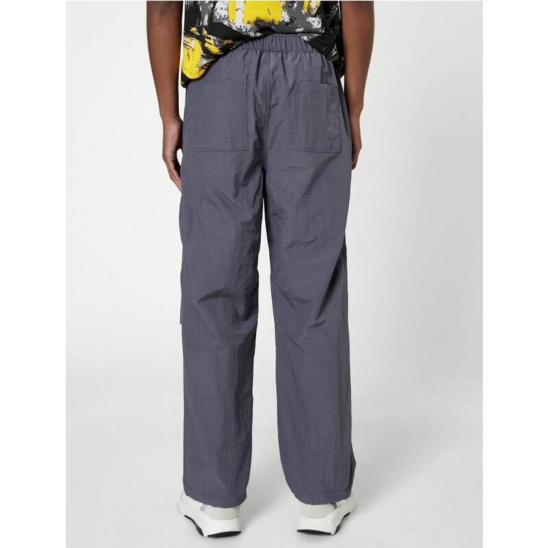 Koton Parachute Trousers with a loose fit, lacing at the waist, and elasticated legs with a pocket detail.