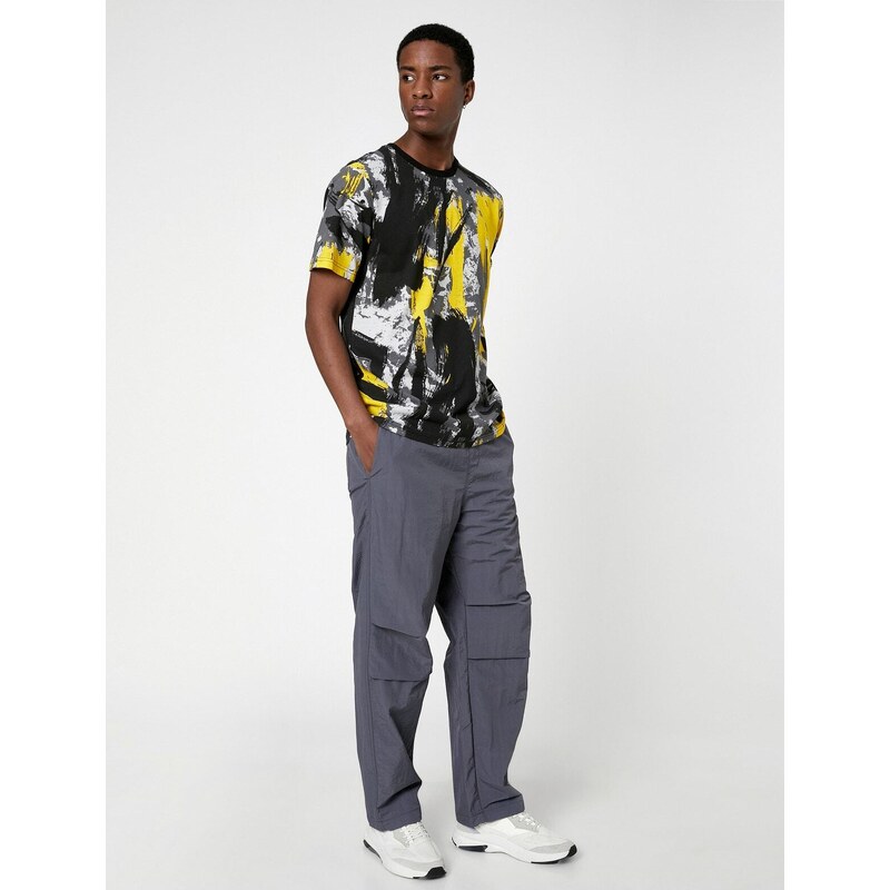 Koton Parachute Trousers with a loose fit, lacing at the waist, and elasticated legs with a pocket detail.