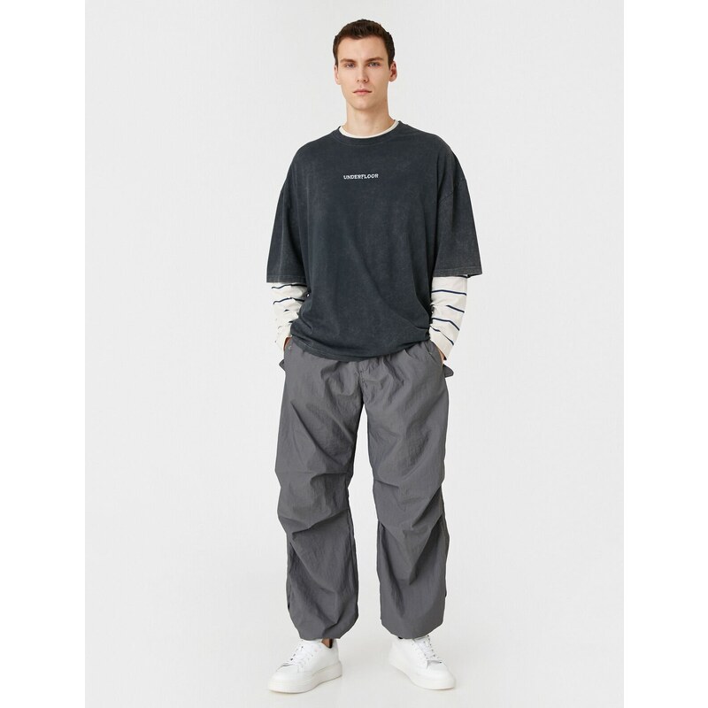 Koton Parachute Trousers with a loose fit, lacing at the waist, and elasticated legs with a pocket detail.