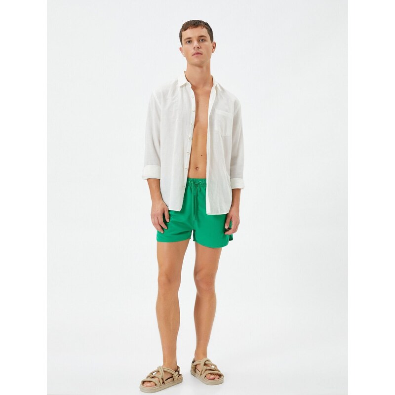 Koton Swimsuit Shorts Short waist with a tie-down pocket.