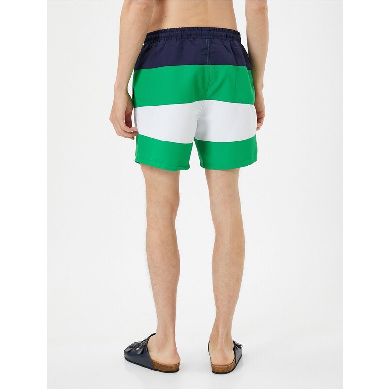 Koton Marine Shorts with Color Block with a drawstring waist and pocket.