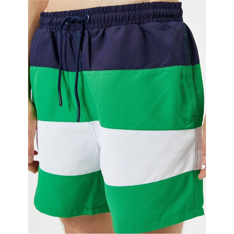 Koton Marine Shorts with Color Block with a drawstring waist and pocket.