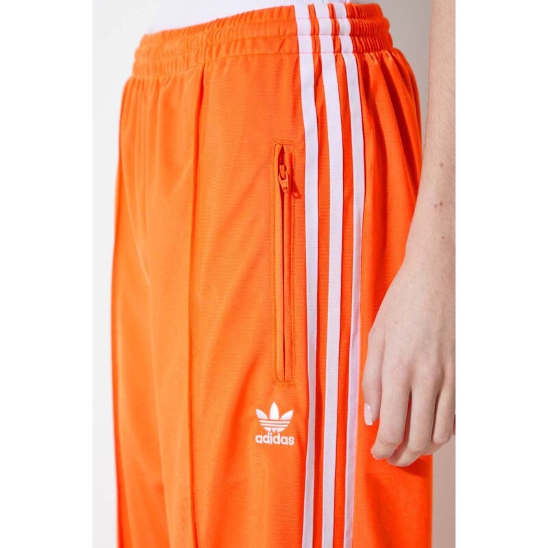 Tepláky adidas Originals oranžová barva, s aplikací, IP0640