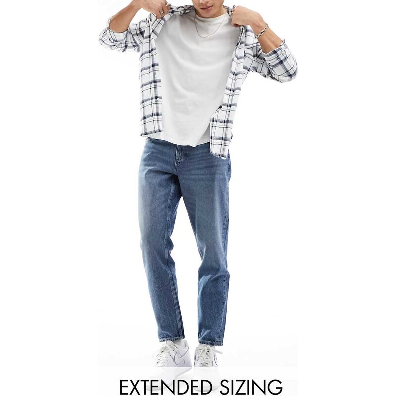 ASOS DESIGN tapered fit jeans in mid wash blue