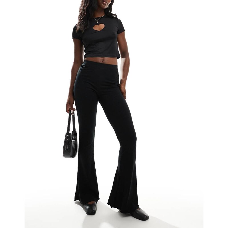 ASOS DESIGN rib flare trouser with lettuce hem in black