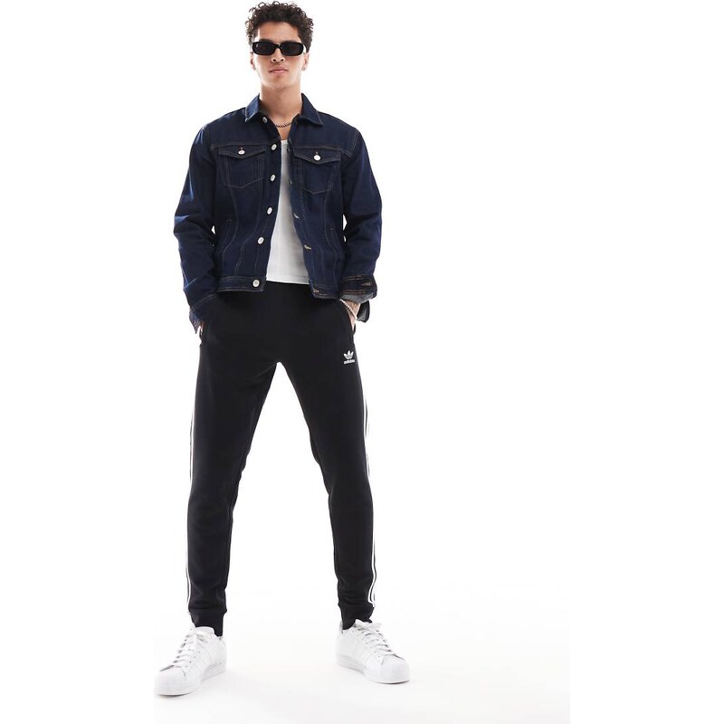 adidas Originals three stripe joggers in black