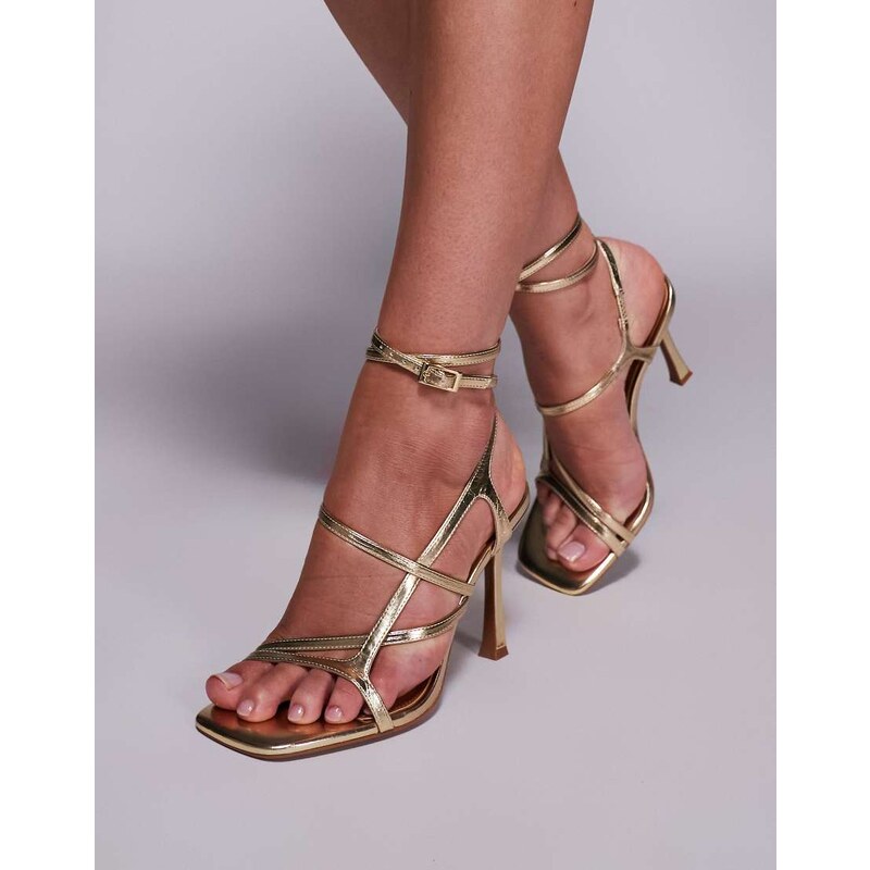 ASOS DESIGN Nutty caged high heeled sandals in gold 103259901