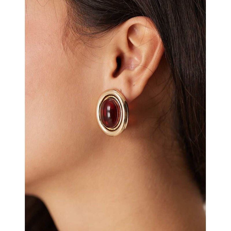 ASOS DESIGN stud earrings with burgundy stone set design in gold