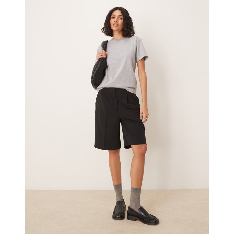 AWARE pleat front tailored shorts in black