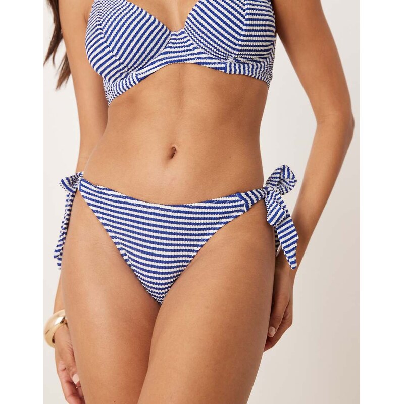Peek & Beau Fuller Bust stripe crinkle tie side bikini bottom in navy 104899137