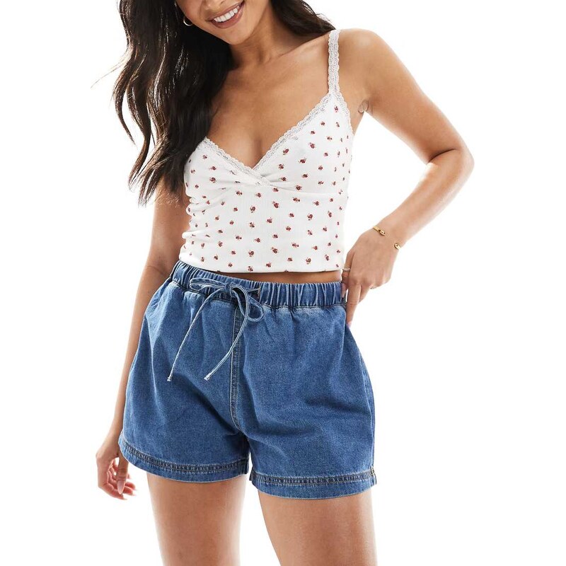 ASOS DESIGN jogger style denim pull on short in mid blue 105247339