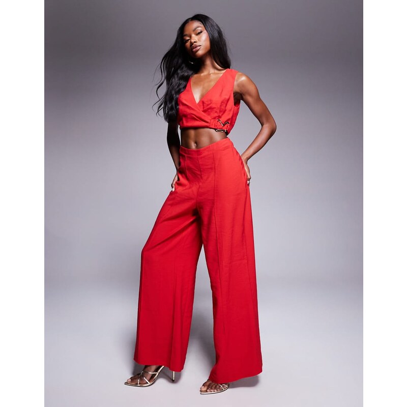 ASOS DESIGN wrap front cut out jumpsuit with buckle detail in