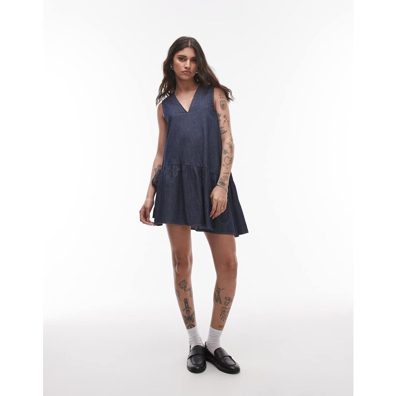 Topshop denim mini dress with peplum hem and bow detail in raw