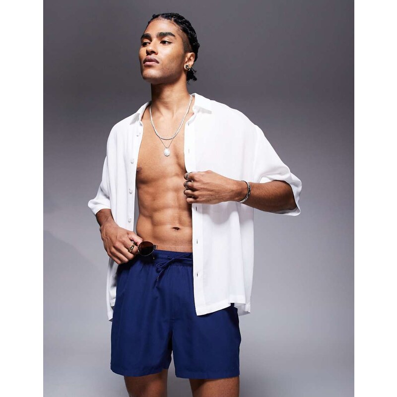 ASOS DESIGN swim shorts in short length in navy