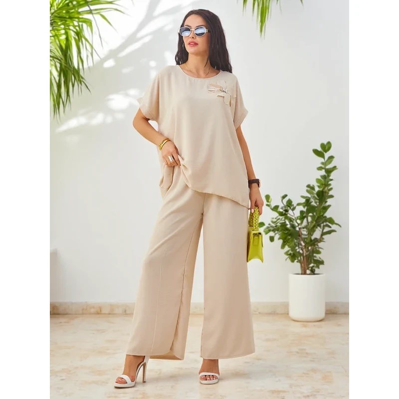 Resti Womens set with short sleeves, decorative flower, and wide