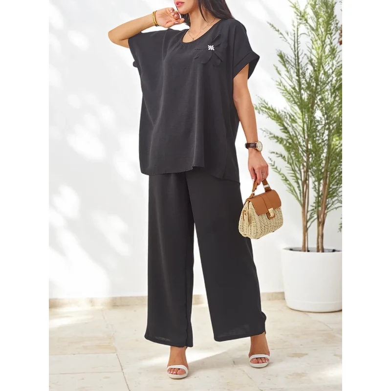 Resti Womens set with short sleeves, decorative flower, and wide pants 108963605