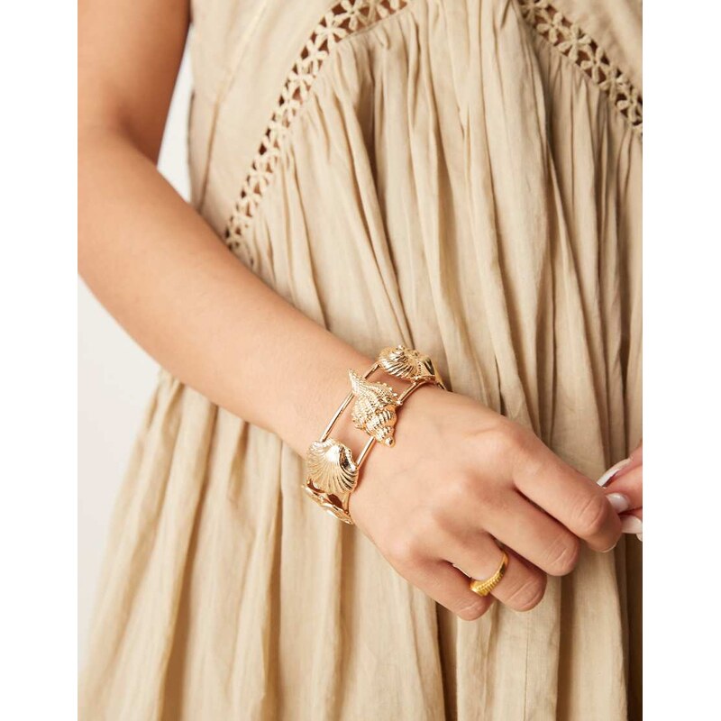 ASOS DESIGN cuff bracelet in mixed shell design in gold tone 105754455