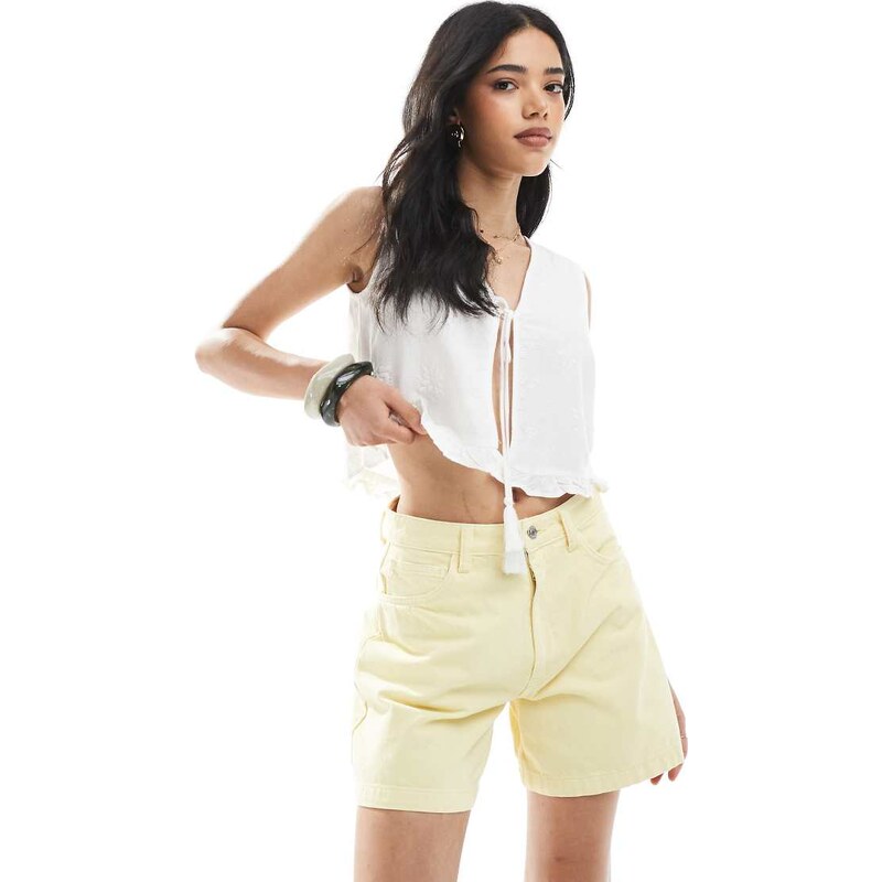 ASOS DESIGN denim longline A line short in buttermilk-Yellow 105841042