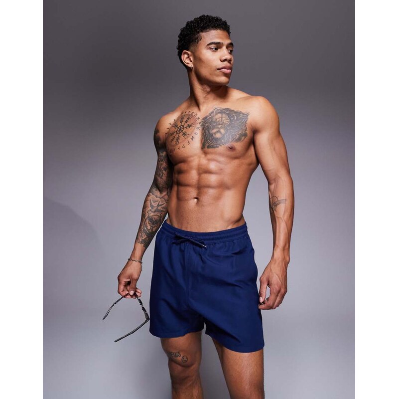 ASOS DESIGN swim shorts in mid length in navy