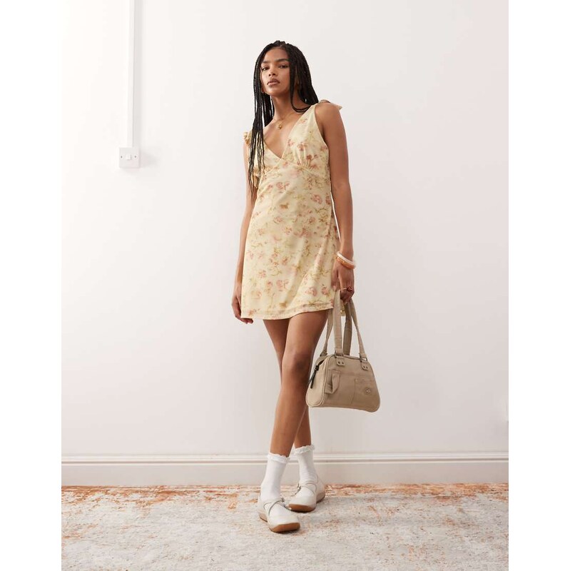 Reclaimed Vintage v-neck mini dress with bow shoulder detail in floral 106131429