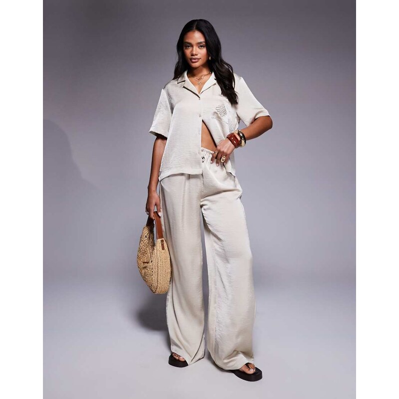 The Couture Club co-ord emblem satin trousers in beige-Neutral 106291635