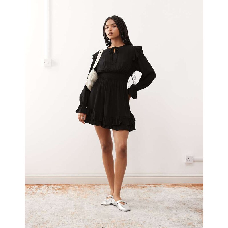 Reclaimed Vintage mini dress with shirred waist and ruffles in black 113261675