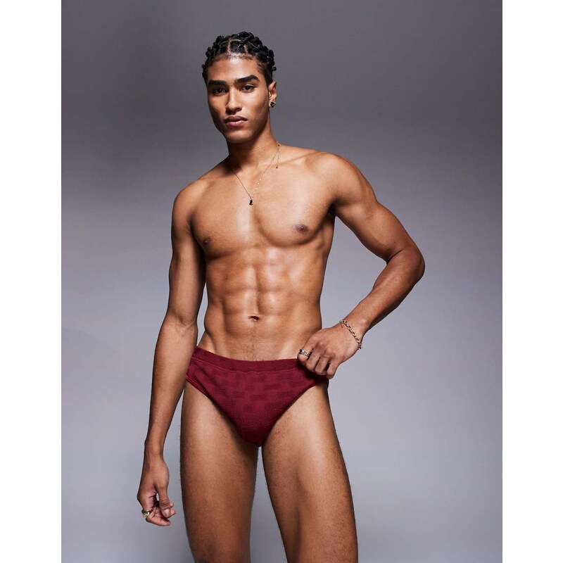 ASOS DESIGN textured swim brief in burgundy
