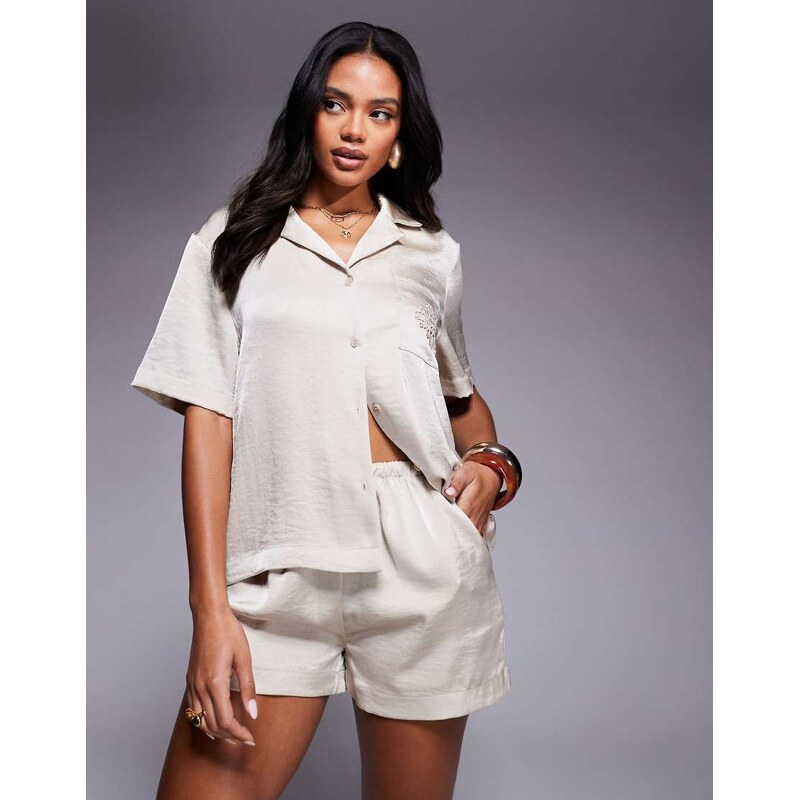 The Couture Club co-ord emblem satin shorts in beige-Neutral 106291637