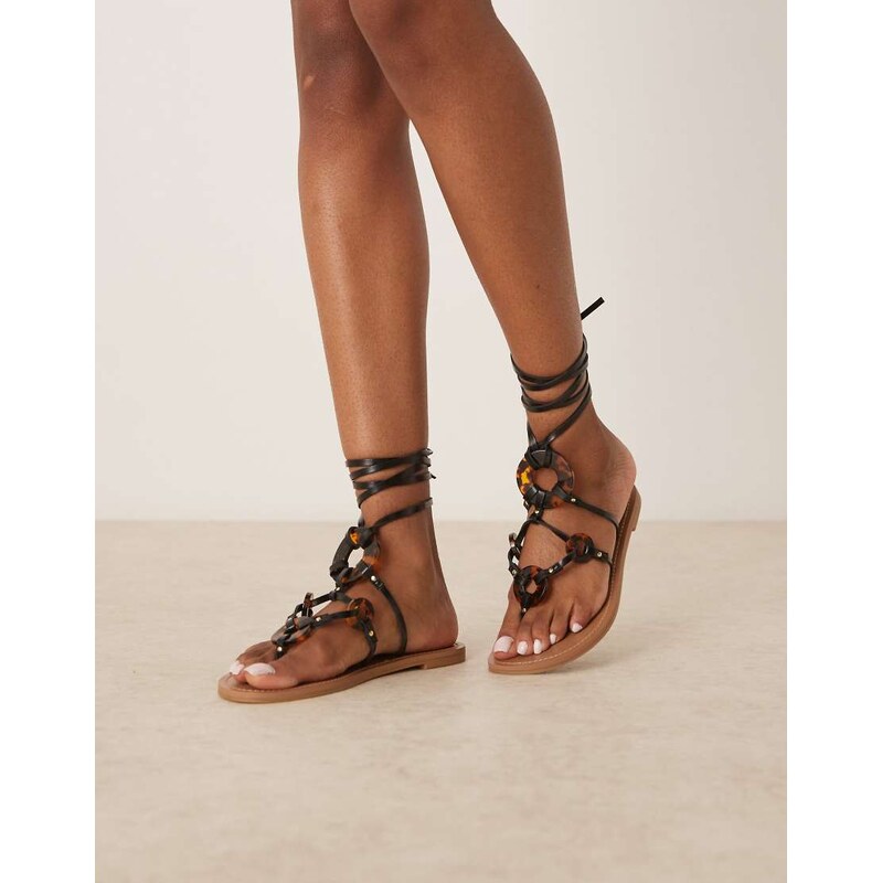 ASOS DESIGN Fiona tortoise trim tie leg flat sandals in black