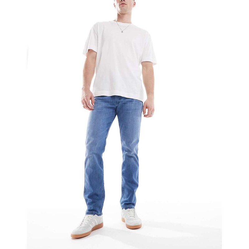 Wrangler Larston slim tapered fit jeans in mid wash blue