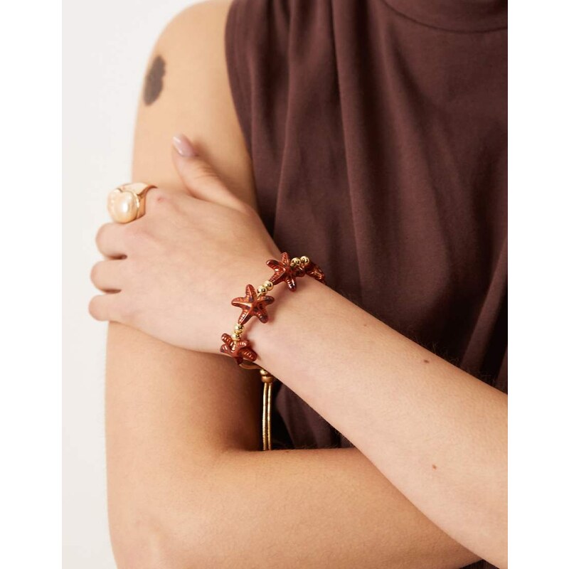 ASOS DESIGN friendship bracelet with tortoise shell starfish in gold 106519568