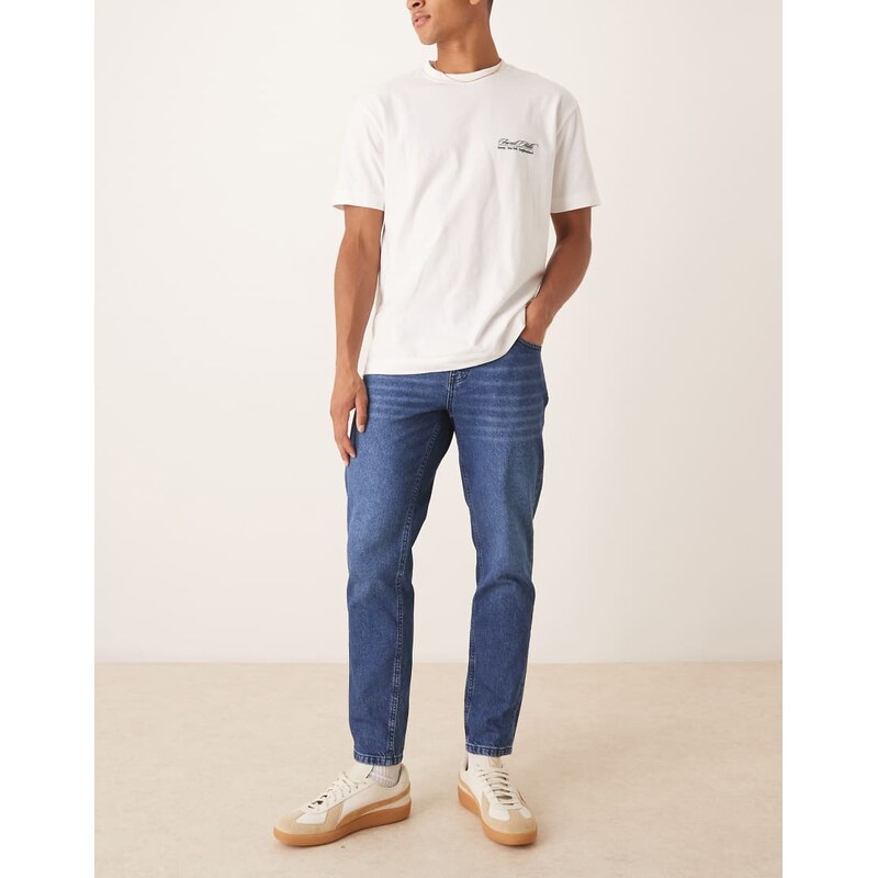 ASOS DESIGN tapered fit jeans in dark wash blue