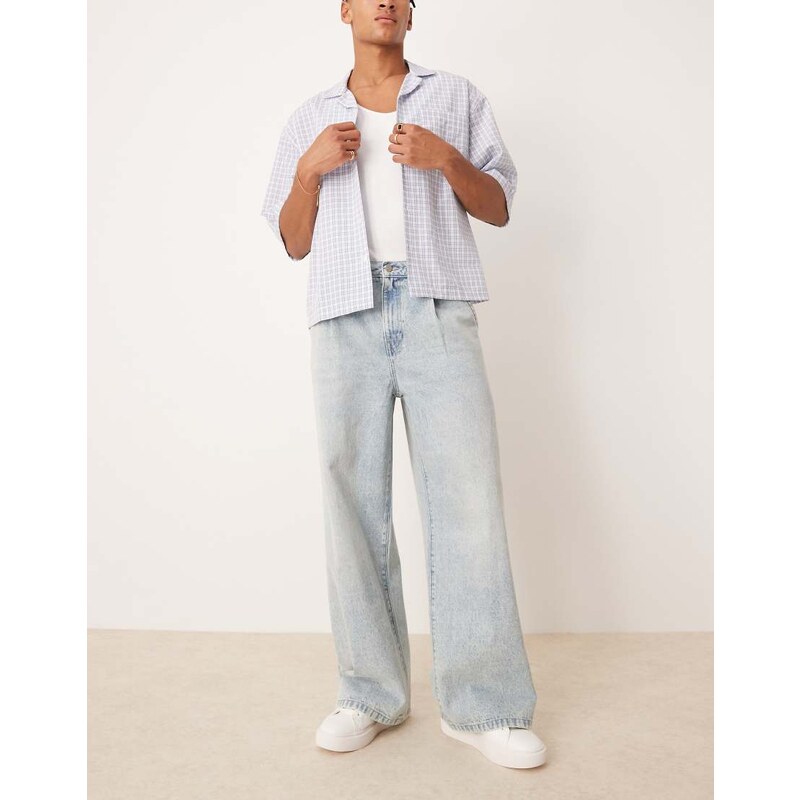 ASOS DESIGN loose jeans with front pleats in light wash blue