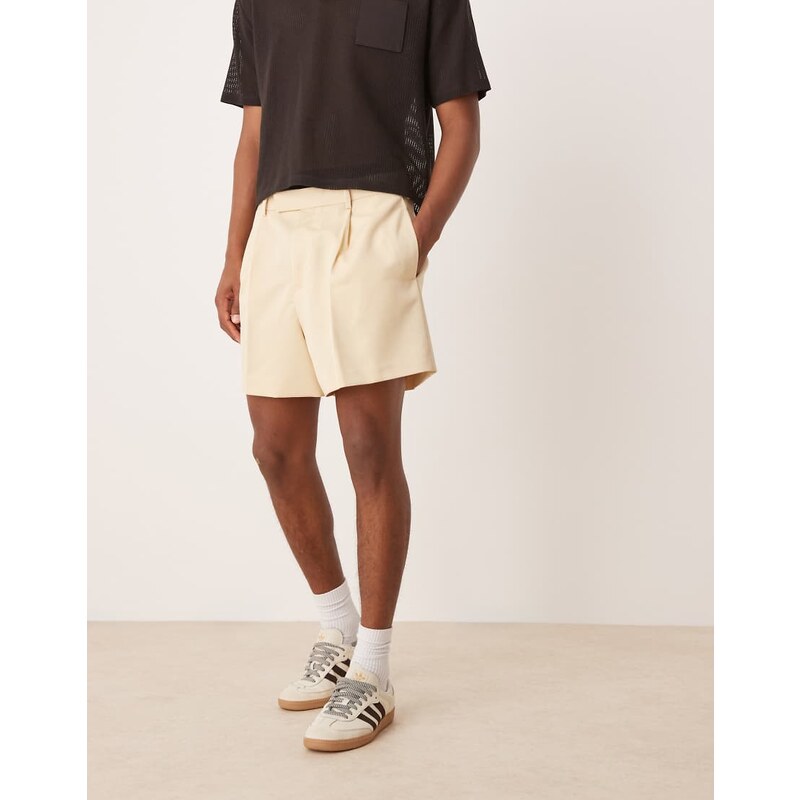 ASOS DESIGN smart bermuda cropped shorts with front pleat in buttermilk-Yellow