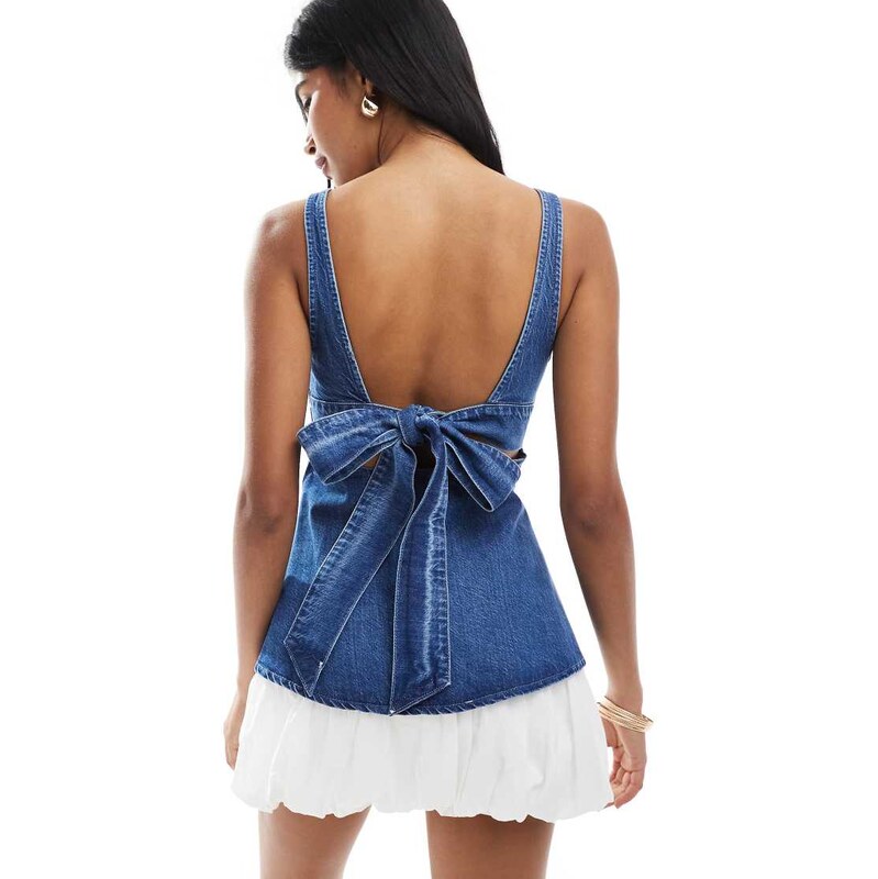 ASOS DESIGN denim peplum top with bow back detail in mid blue
