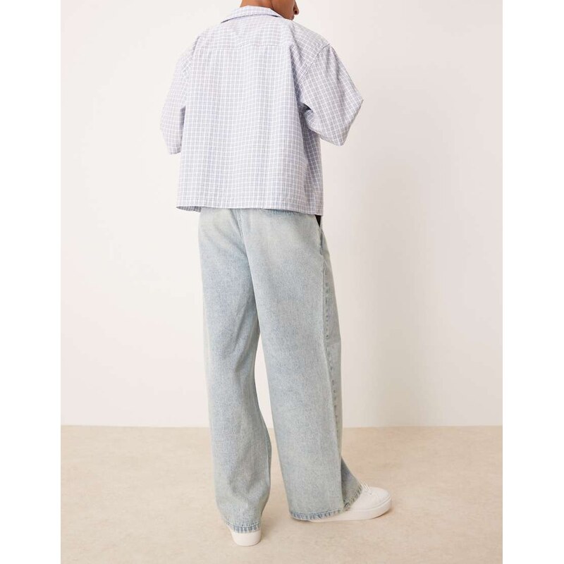 ASOS DESIGN loose jeans with front pleats in light wash blue