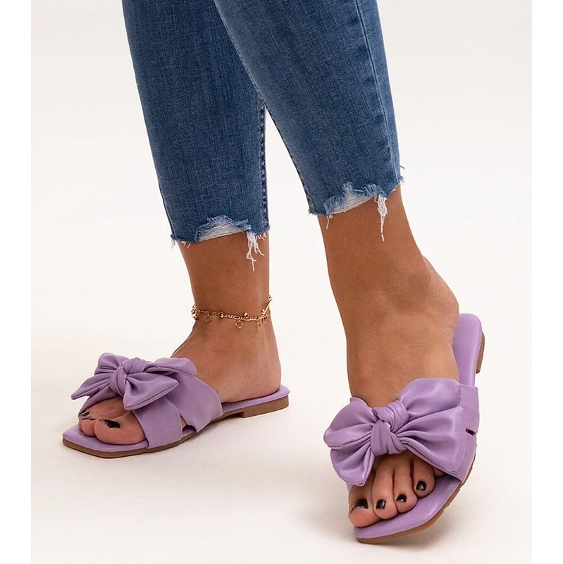 D/CEO Gemre Purple flip-flops with a decorative bow Uwansa