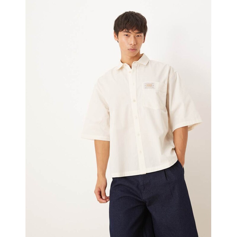 ASOS DESIGN boxy oversized shirt with chest badge in cream