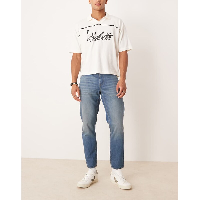 ASOS DESIGN tapered jeans in light wash blue