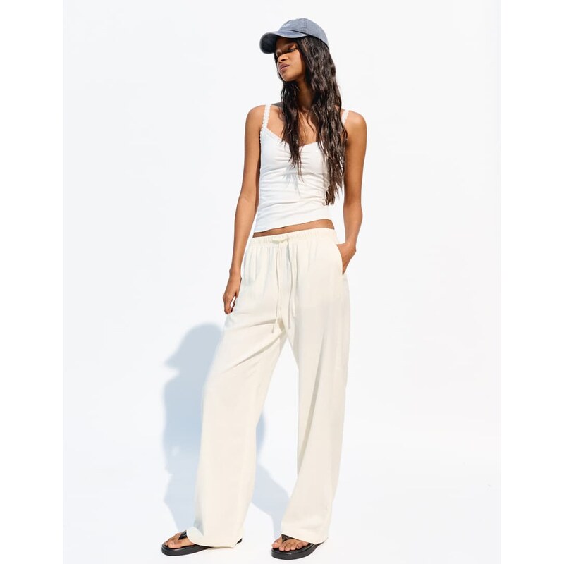 Bershka linen rich trousers with an elasticated waistband in yellow - 107632535
