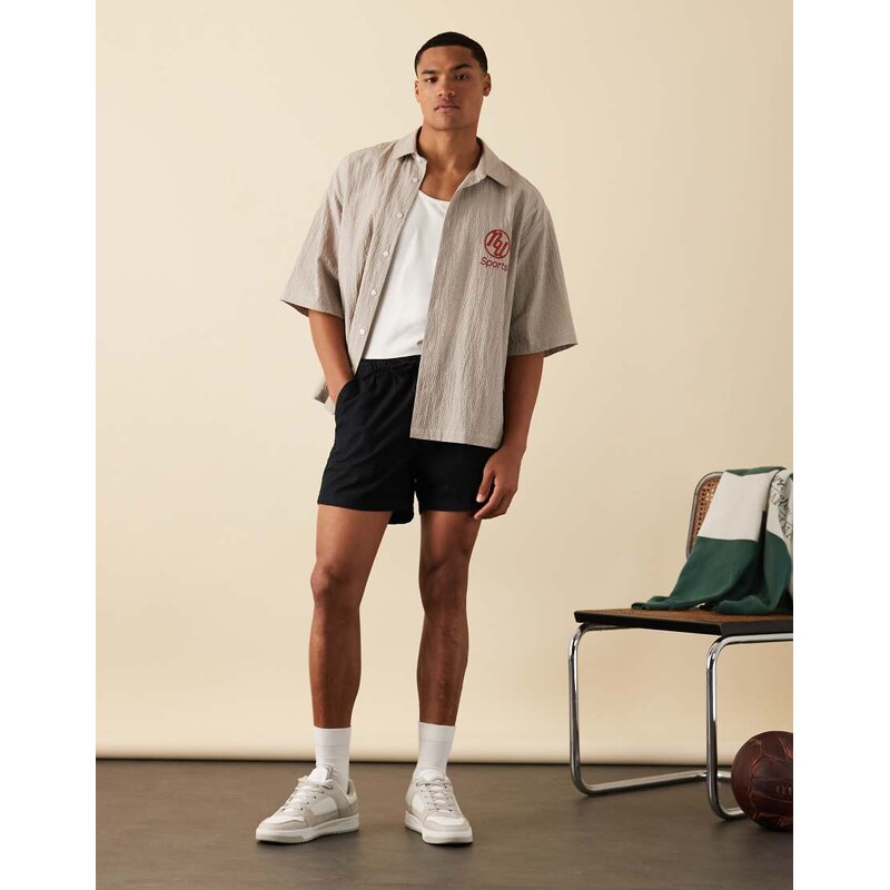 ASOS DESIGN boxy oversized shirt in brown check with chest