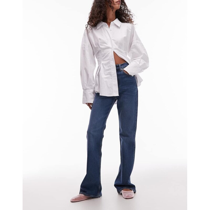 ARKET Rain slim flare jeans in mid wash blue