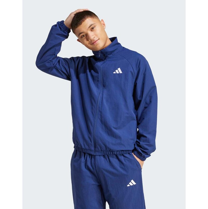 adidas performance Essential small logo windbreaker in dark blue