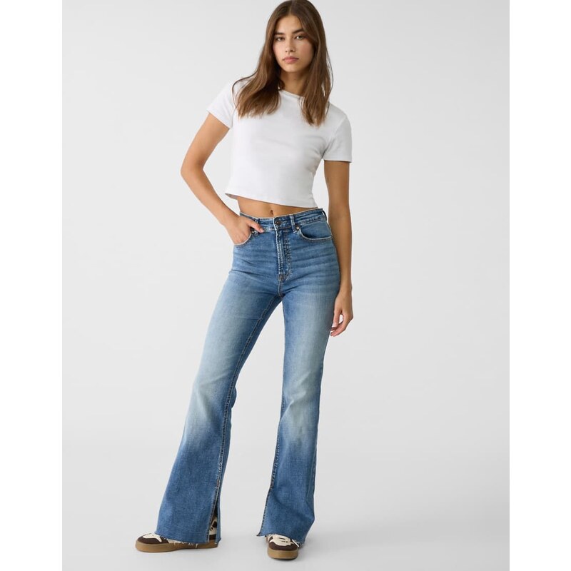 Stradivarius Slit fit flared jeans in mid blue 107997059