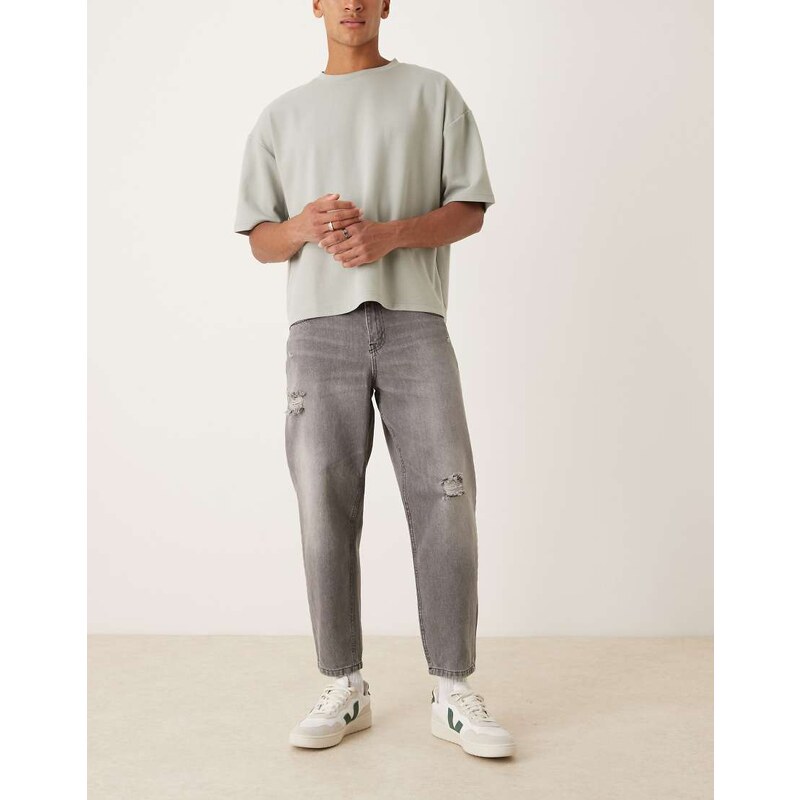 ASOS DESIGN relaxed tapered jeans in washed black with rips
