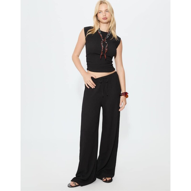 Stradivarius Flowing creased-effect trousers in black
