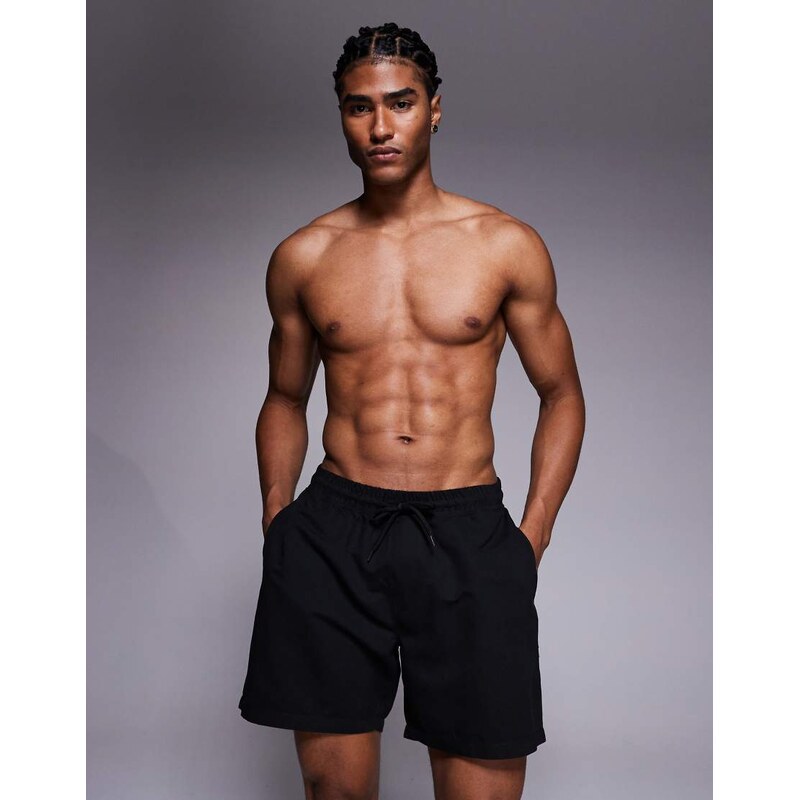 ASOS DESIGN swim shorts in mid length in black
