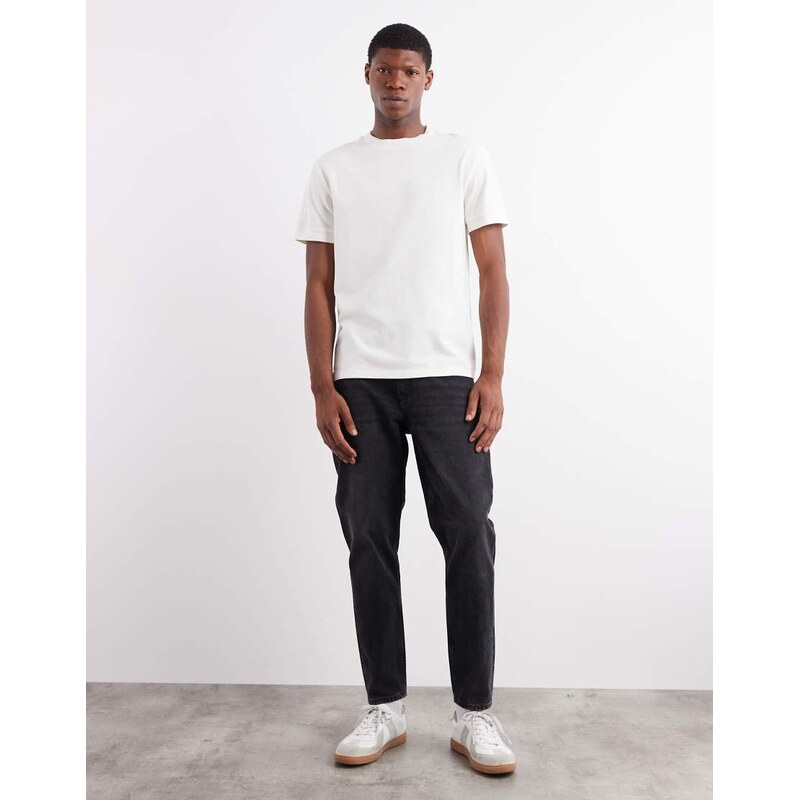 ASOS DESIGN tapered fit jeans in washed black