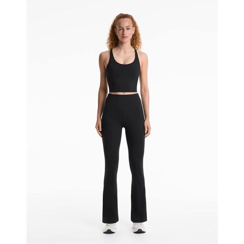 OYSHO Evermove high rise flare trousers in black 108320136