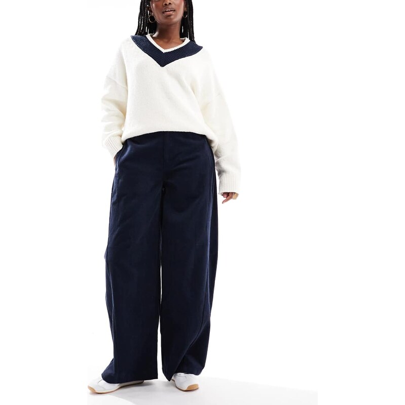 ASOS DESIGN baby cord extreme horseshoe trousers with seam detail in navy-Yellow